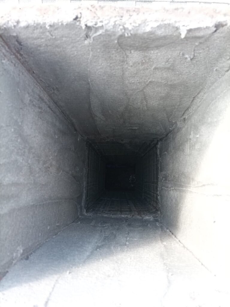 Chimney crown and new cap viewed from a rooftop angle