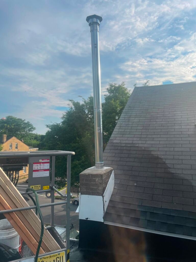 New metal chimney-top assembly and flashing on the shortened chimney base